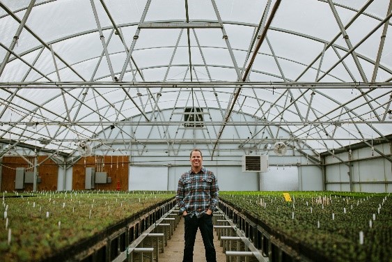 Kevin Brinkman, Founder & CEO of OneCanopy, stands amidst the 34,000-square-foot nursery in Loveland, Colorado.
