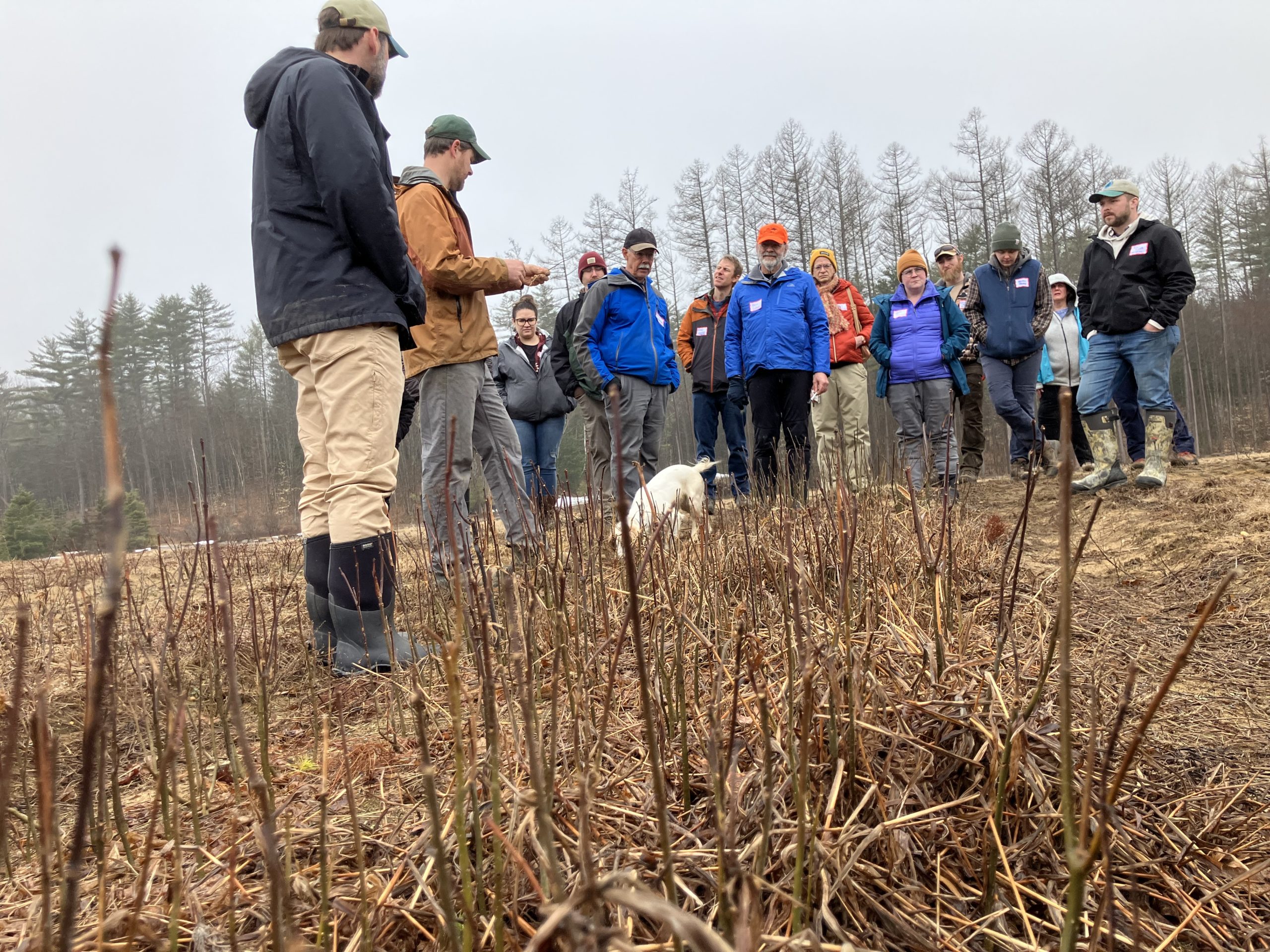 University of Alabama group in front of Caring Days sign