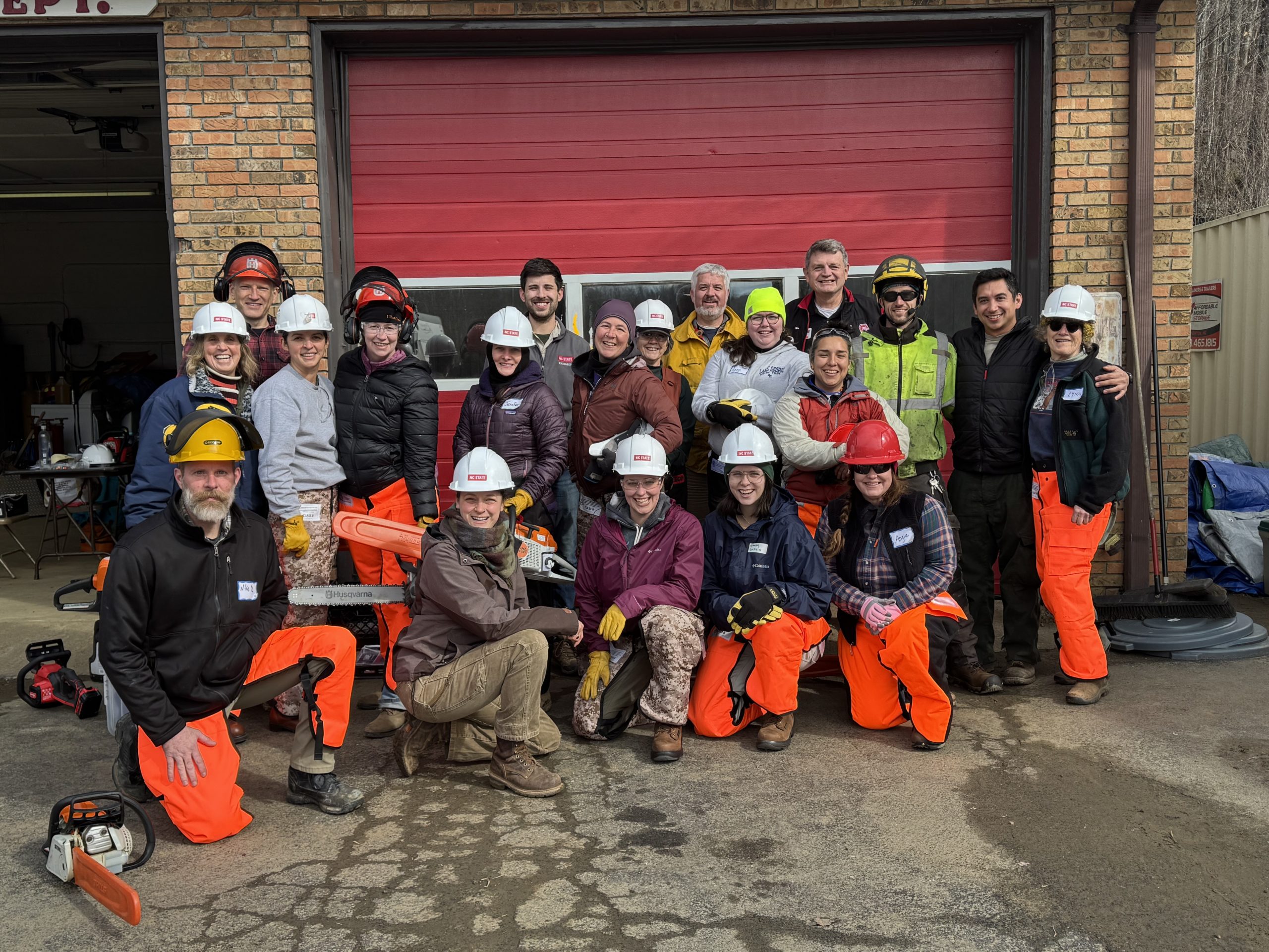 Rachel wearing a blue t-shirt in front of a Southwest landscape resembling the Grand Canyon