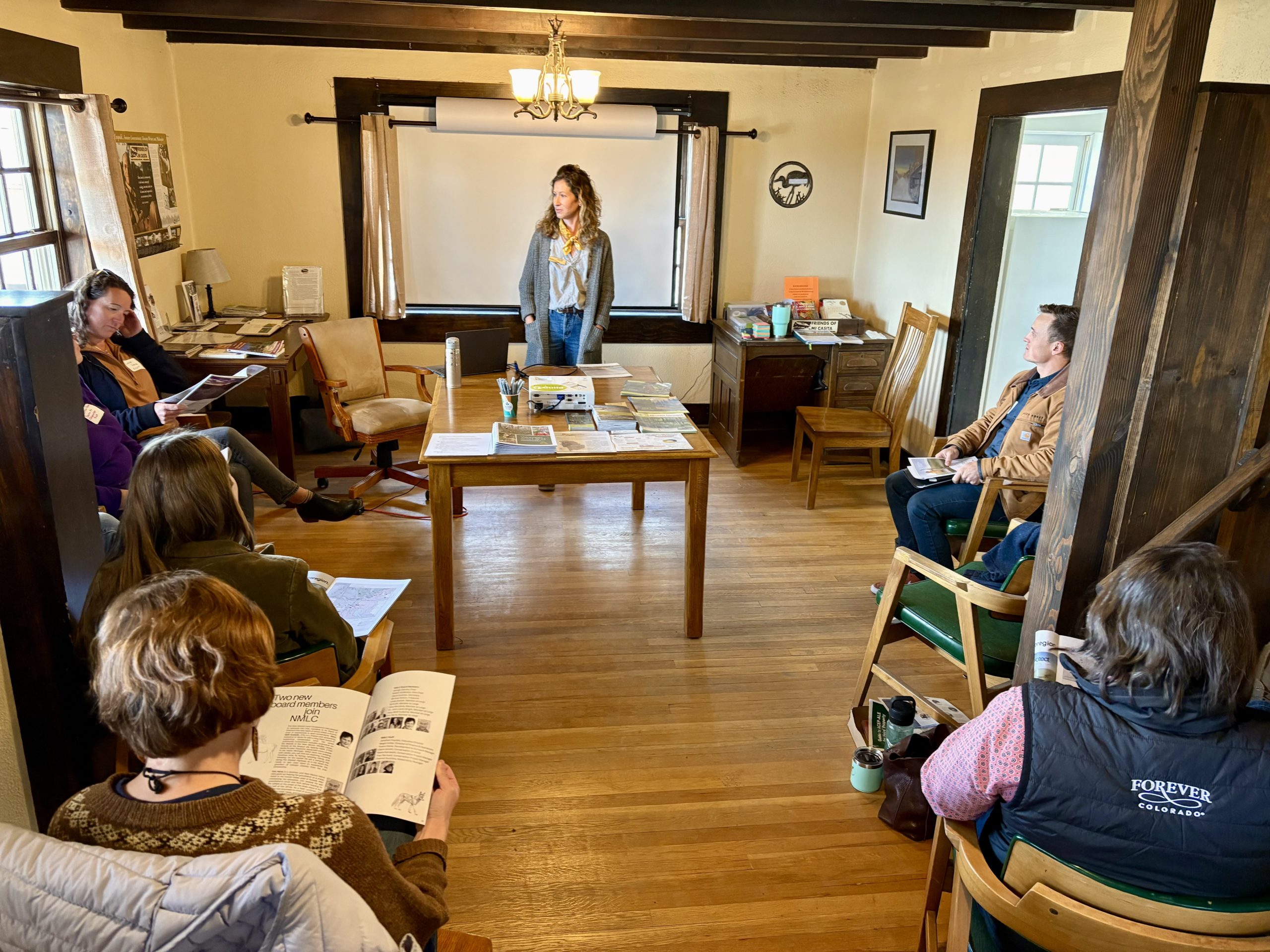University of Alabama group in front of Caring Days sign