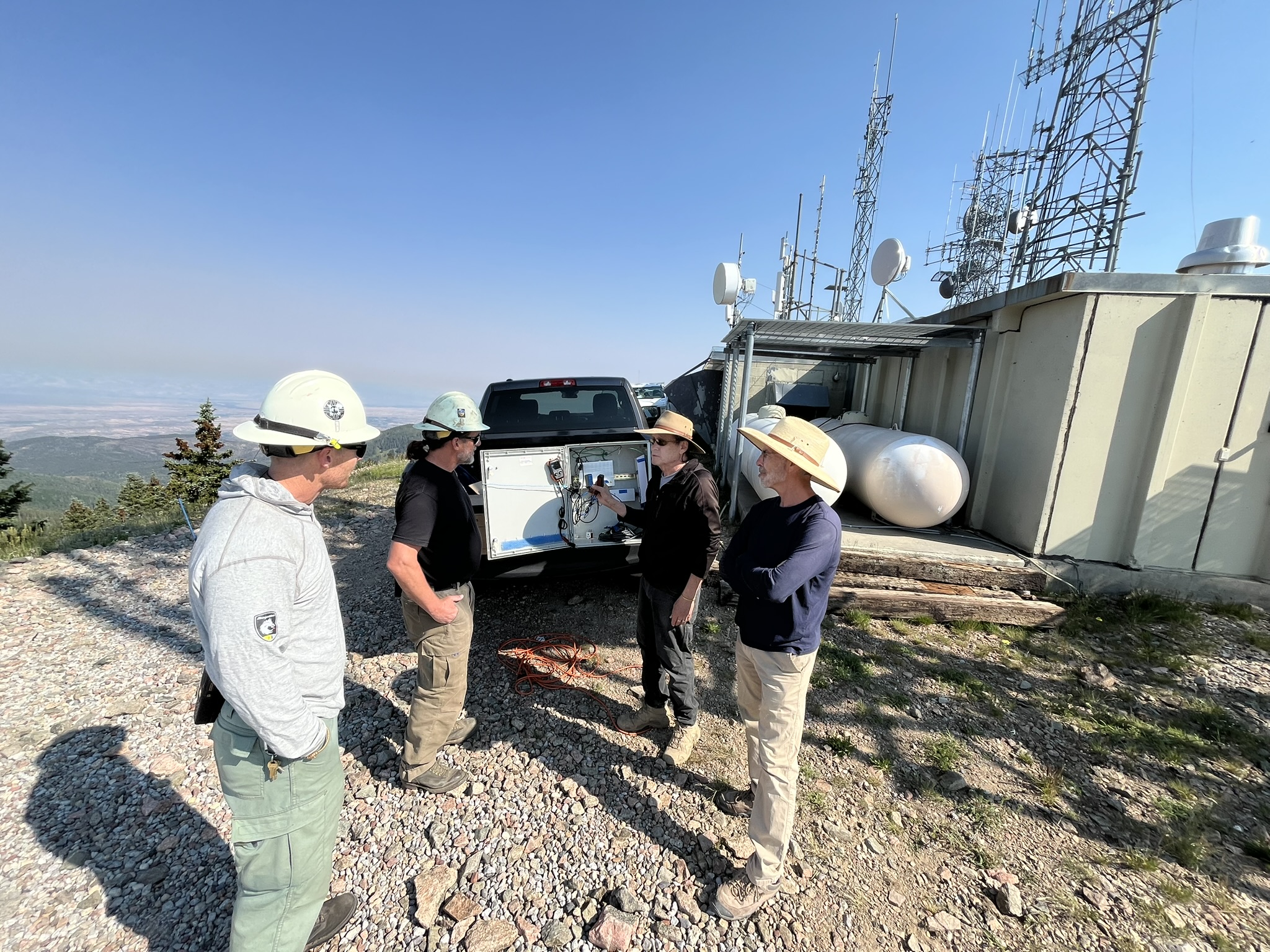University of Alabama group in front of Caring Days sign