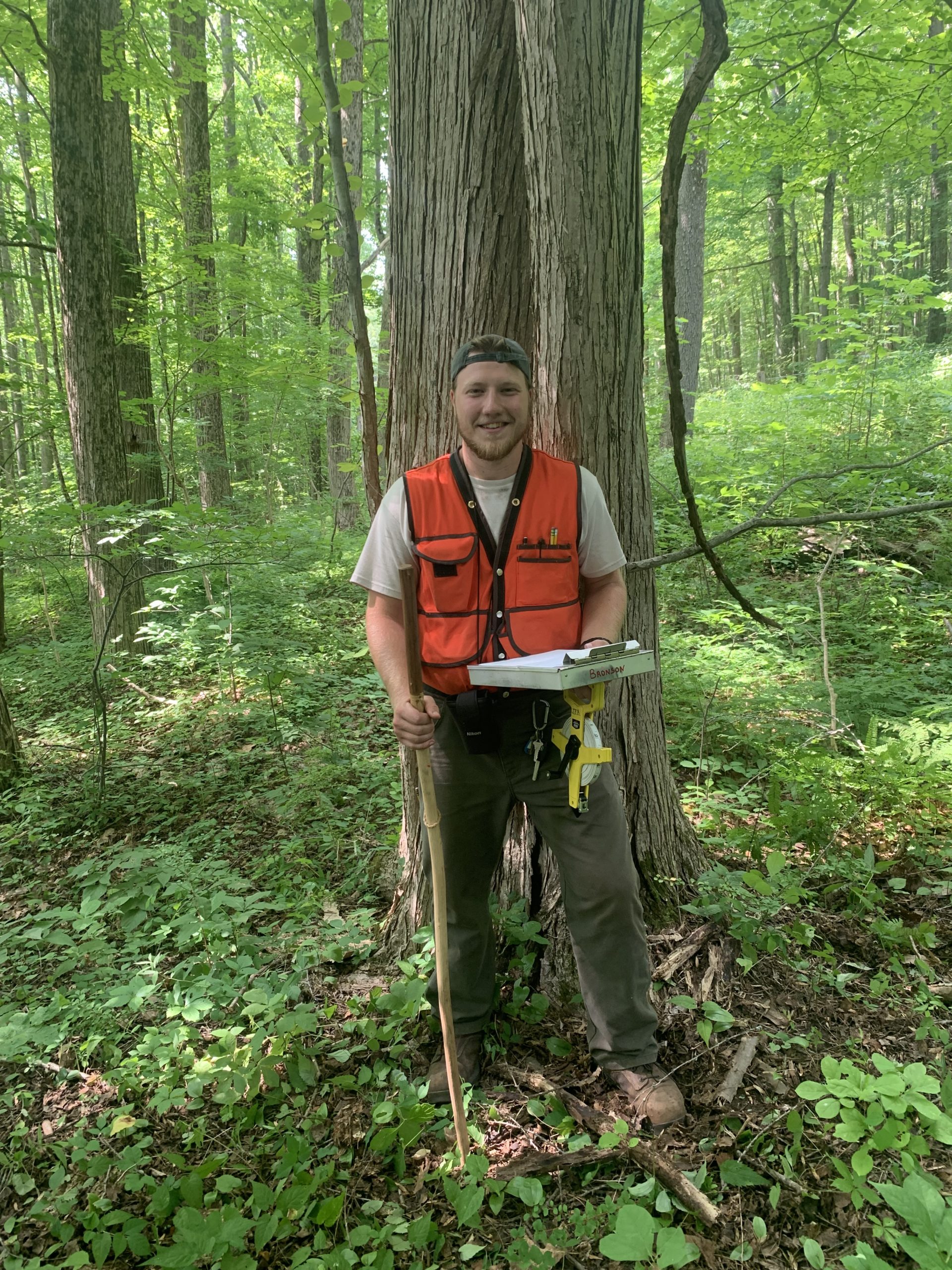 University of Alabama group in front of Caring Days sign